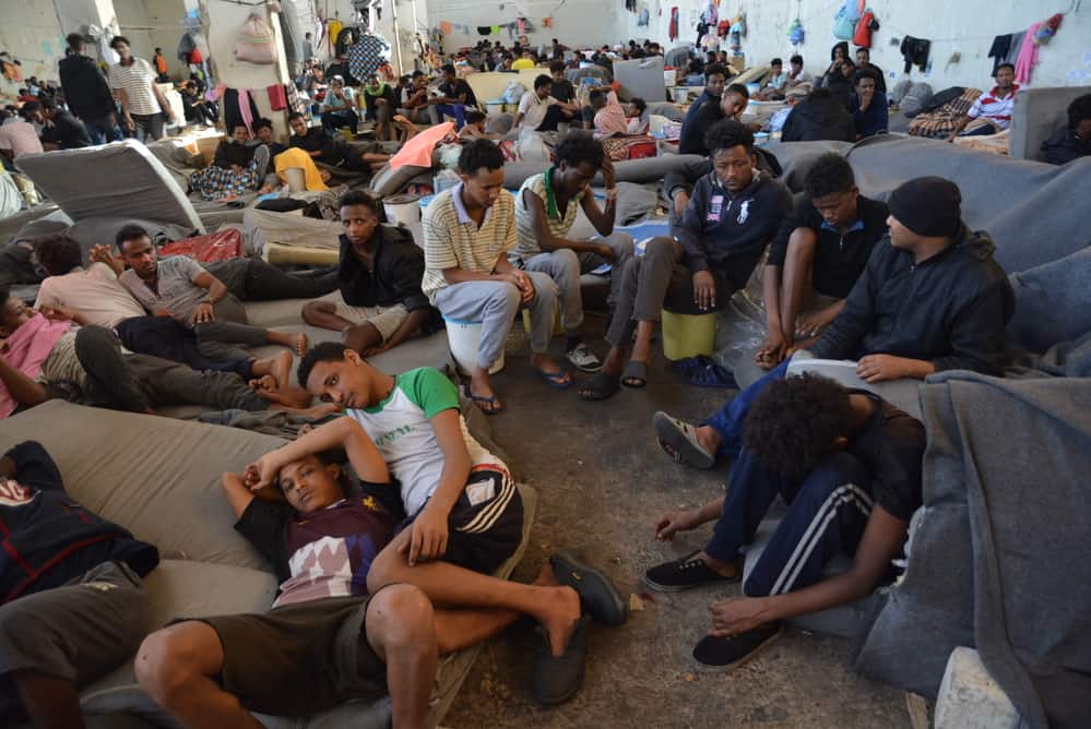 Refugees living among unsanitary conditions in Zintan detention centre. People had access to four barely functioning toilets, buckets to urinate, no shower and only sporadic access to water, which was not suitable for drinking.
©JÉRÔME TUBIANA/MSF