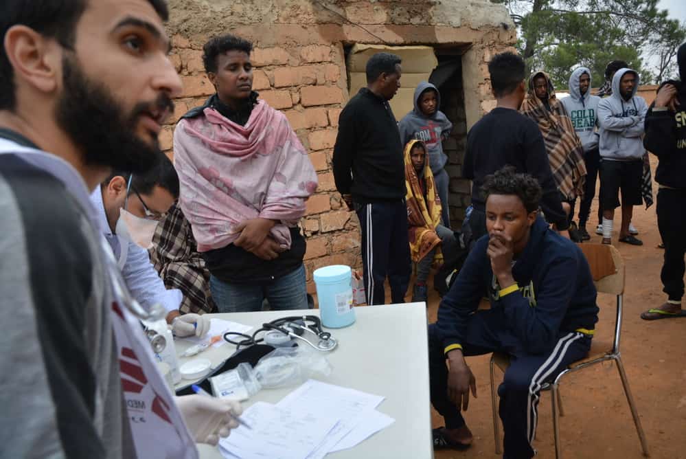 MSF staff conduct medical consultations, treating what illnesses they could, for refugees and migrants in Zintan detention centre. Libya, June 2019. © JÉRÔME TUBIANA/MSF