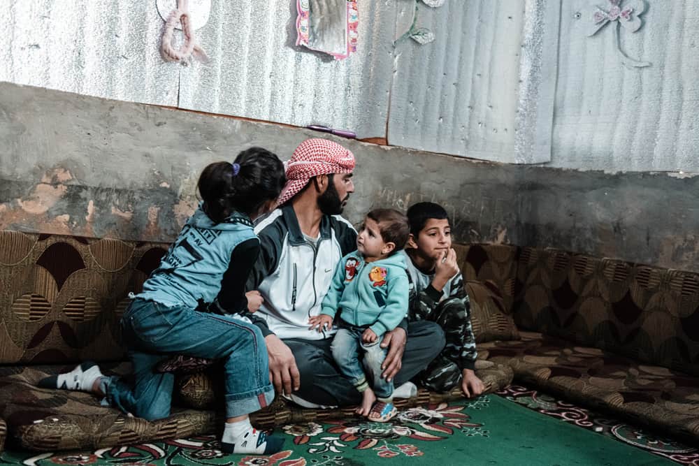 Ahmed (34 years) is a father of four. He arrived in Lebanon with his family from Syria in 2015. Since then, they have been living in an informal tented settlement in the outskirts of Arsal, a town in the north of Bekaa Valley. Lebanon, December 2020. © KARINE PIERRE/HANS LUCASINSTAGRAM: @PICS_STONE