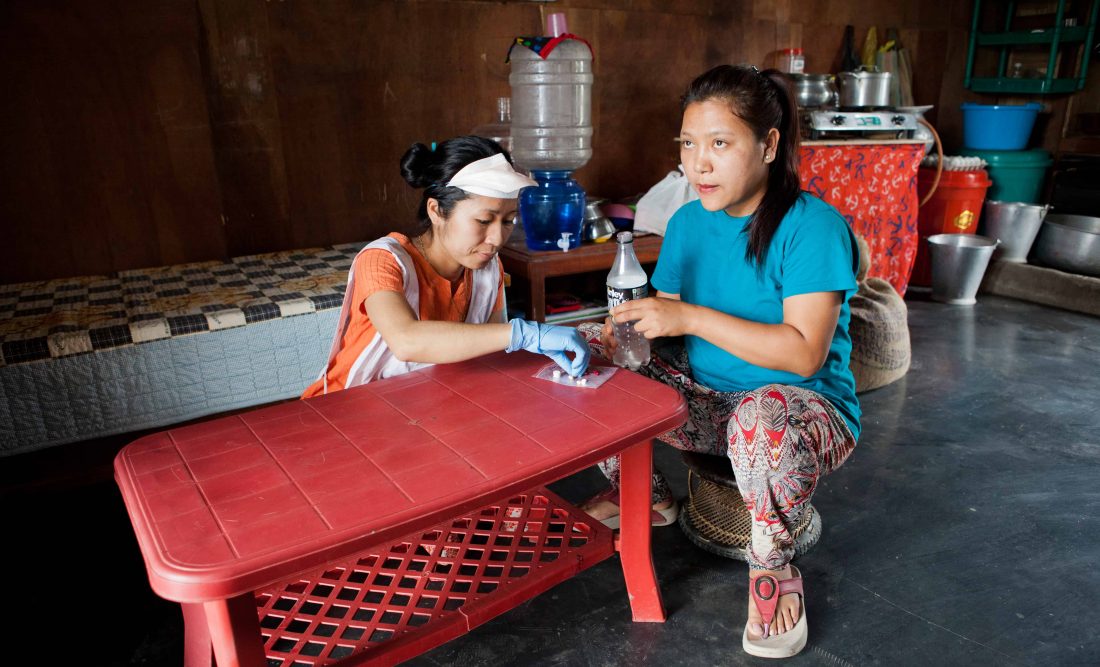 Gracy Chingnuamkin, 21 years old, is an MDR-TB patient from Churachandpur who receives home-based care from MSF. During this home visit, an MSF nurse ensures Gracy is taking all the required pills - 15 each day - and therefore properly adhering to her treatment. Manipur, India, April 2019. © JAN-JOSEPH STOK
